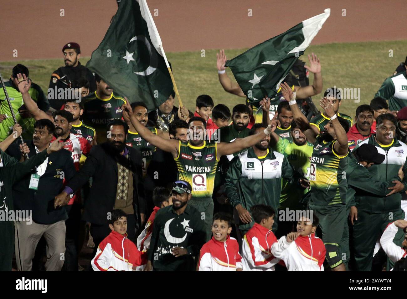 Lahore, Pakistan. 16th Feb, 2020. Pakistani Kabaddi team's players wave Pakistan national flags and spectators are celebrating its victory after winning final match of Kabaddi World Cup 2020, as Pakistan won the kabaddi world-cup 2020 by 2 points scoring 43-41 for the first time at Punjab Stadium in Lahore. (Photo by Rana Sajid Hussain/Pacific Press) Credit: Pacific Press Agency/Alamy Live News Stock Photo