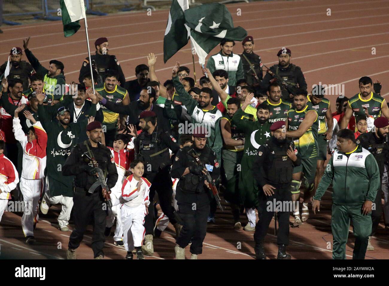 Pakistani Kabaddi team's players wave Pakistan national flags and spectators are celebrating its victory after winning final match of Kabaddi World Cup 2020, as Pakistan won the kabaddi world-cup 2020 by 2 points scoring 43-41 for the first time at Punjab Stadium in Lahore. (Photo by Rana Sajid Hussain/Pacific Press) Stock Photo