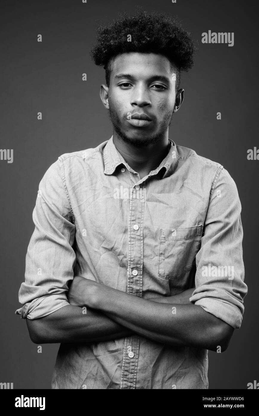 Portrait handsome african guy arms Black and White Stock Photos ...