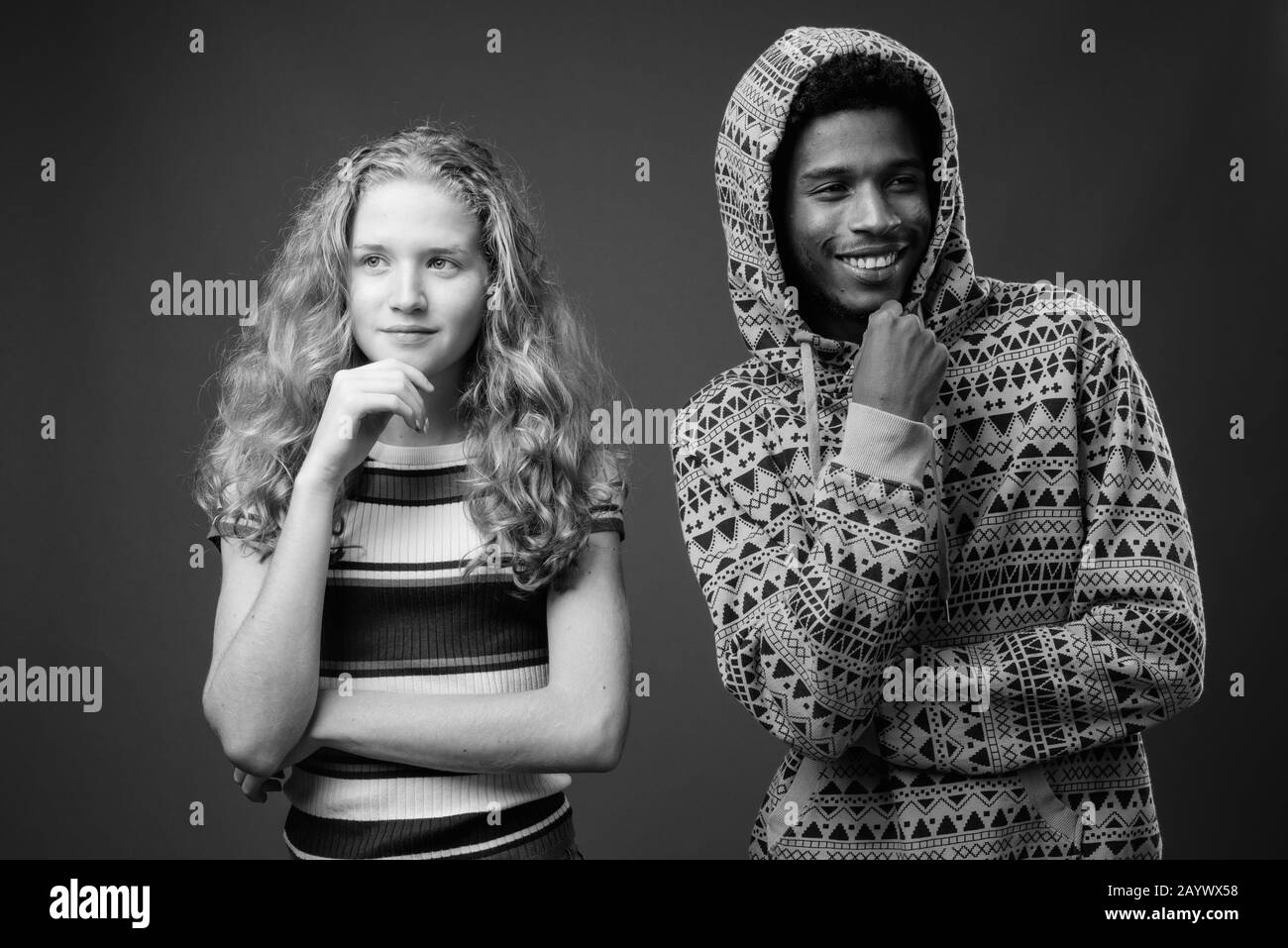 Young African man with teenage girl together against gray background Stock  Photo - Alamy