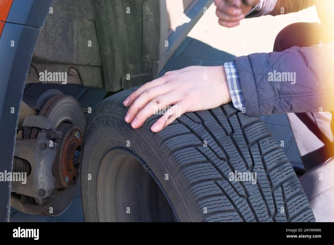 Wheel balancing or repair and change car tire. Automobile maintenance concept. Damaged car tyre