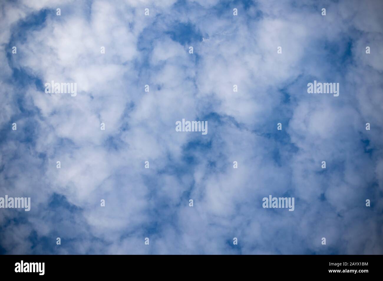 Fluffy White Clouds In The Blue Sky For Background Stock Photo Alamy