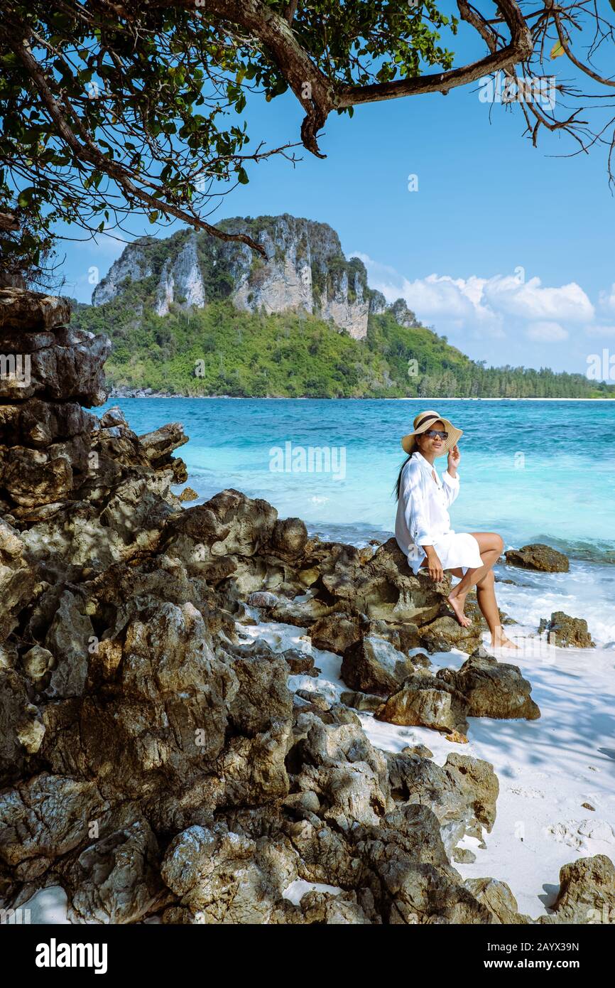 Tup Ilsand Krabi Thailand, woman on the beach watching the clear ocean Stock Photo