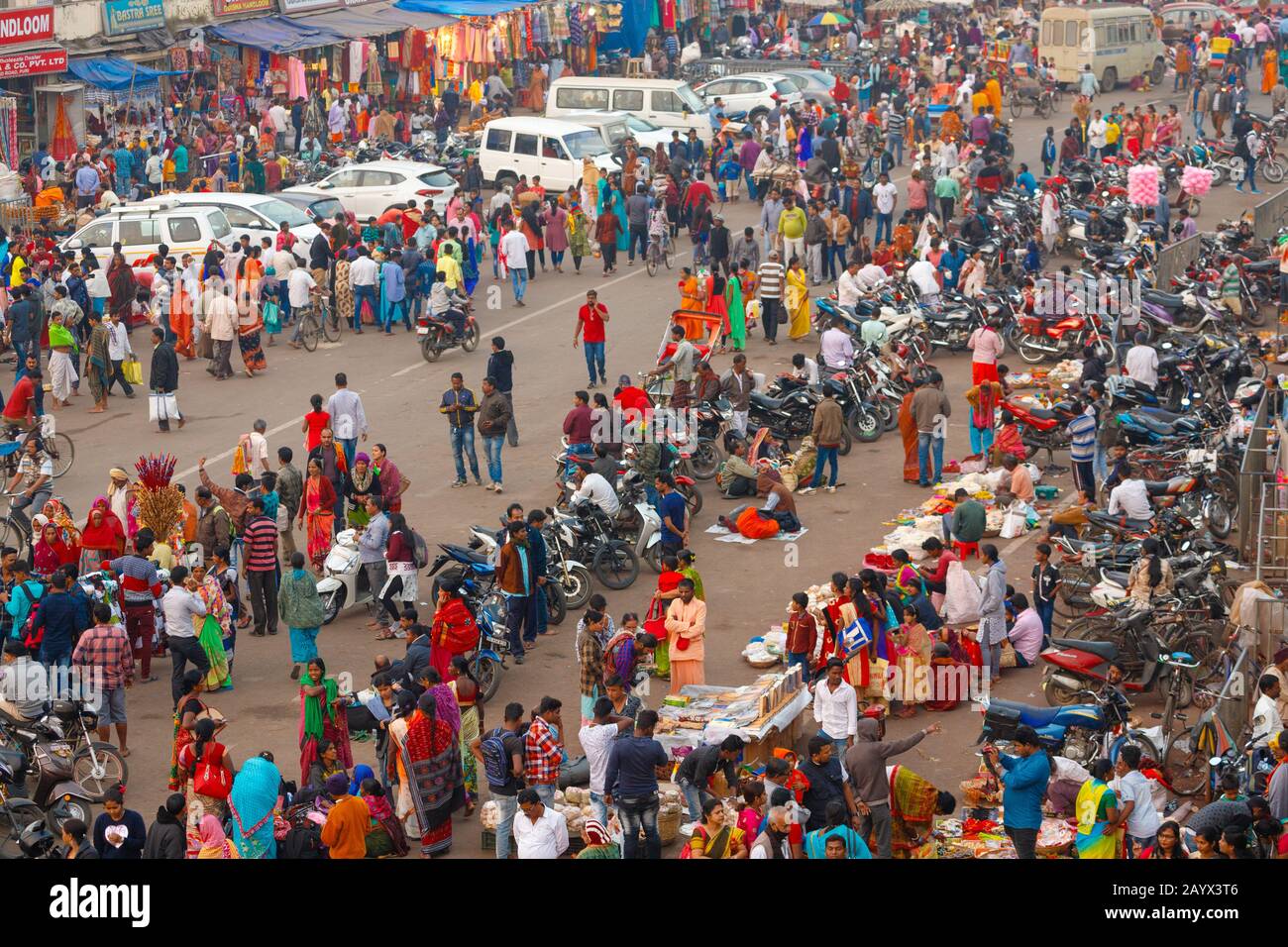 PURI, INDIA, JANUARY 13, 2019 : Perspective point of view of the crowded street market at dusk near the famous Shree Jagannath Temple Stock Photo