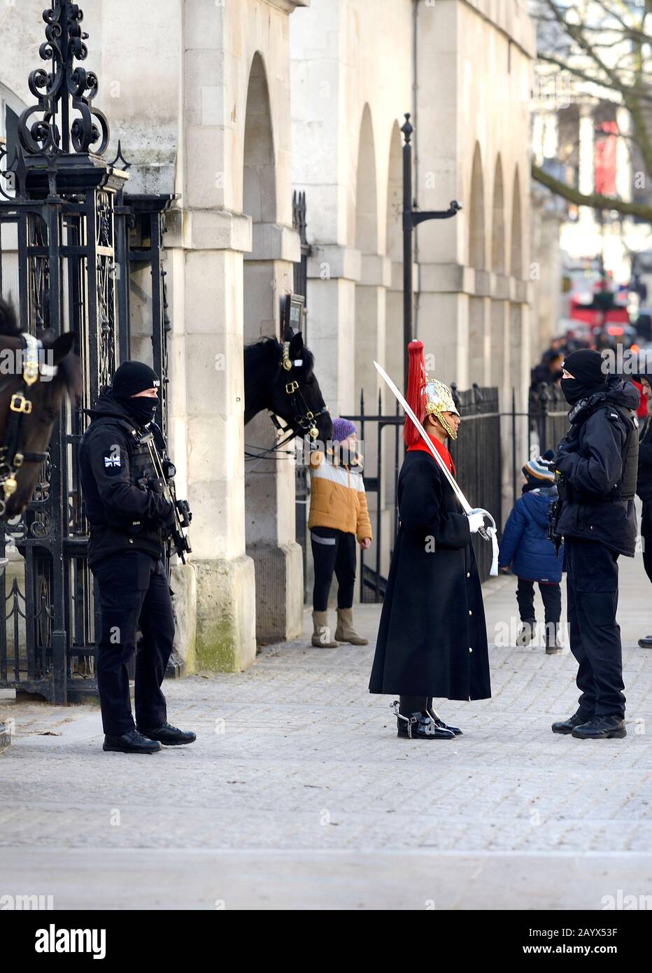 London, England, UK. Member of the Blues and Royals with armed police in Whitehall outside Horse Guards Parade Stock Photo