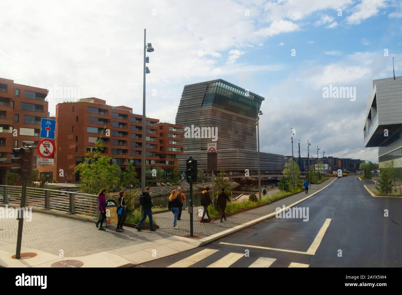View of Oslo city waterfront Bjørvika neighborhood with Lambda art museum and new residential buildings and Opera House on the right.Norway Stock Photo