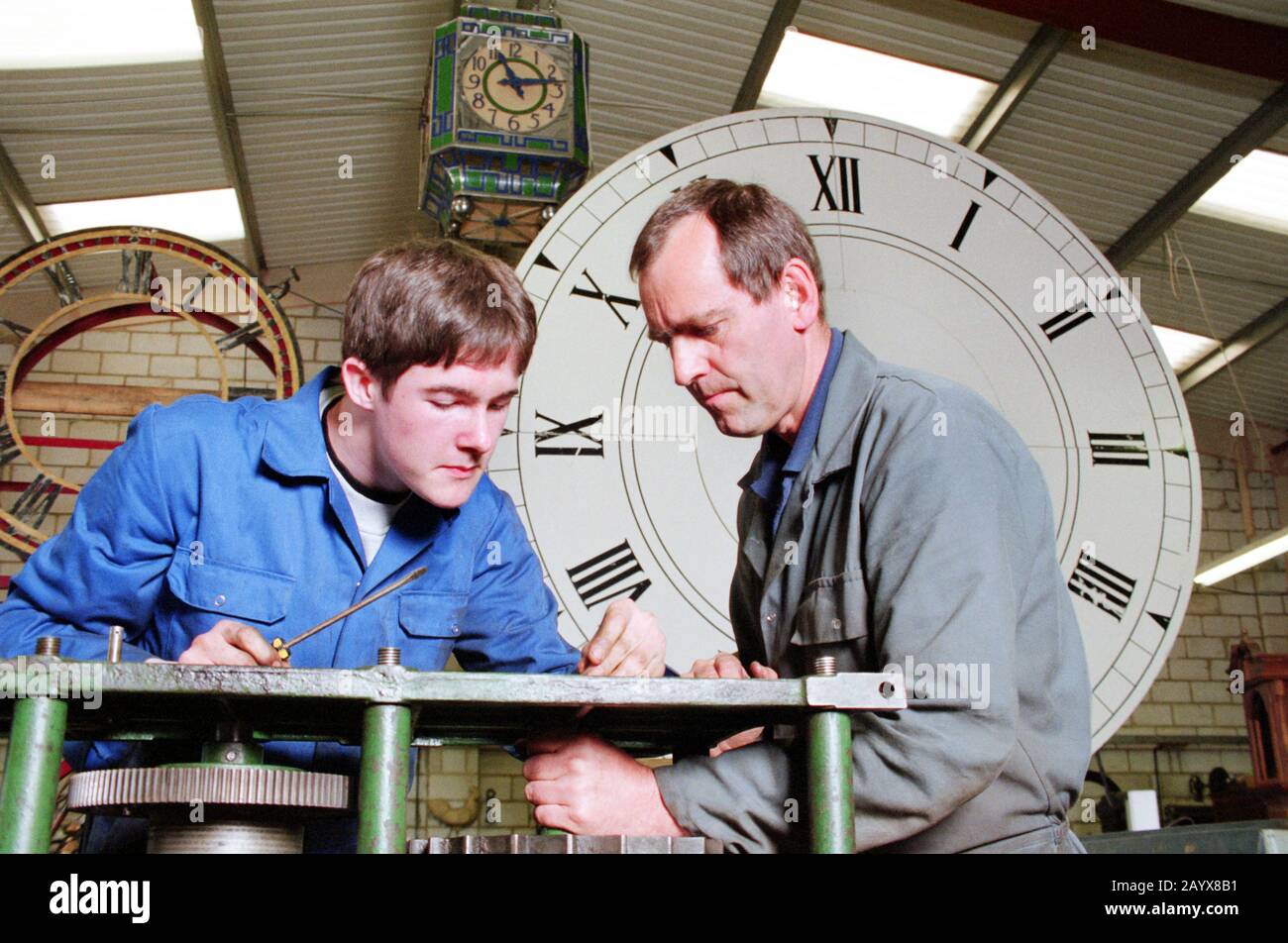 modern apprentice clock maker Stock Photo