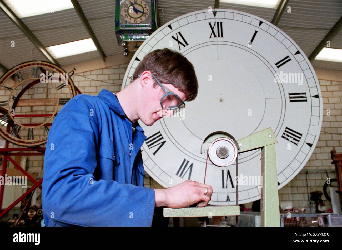 modern apprentice clock maker Stock Photo Alamy