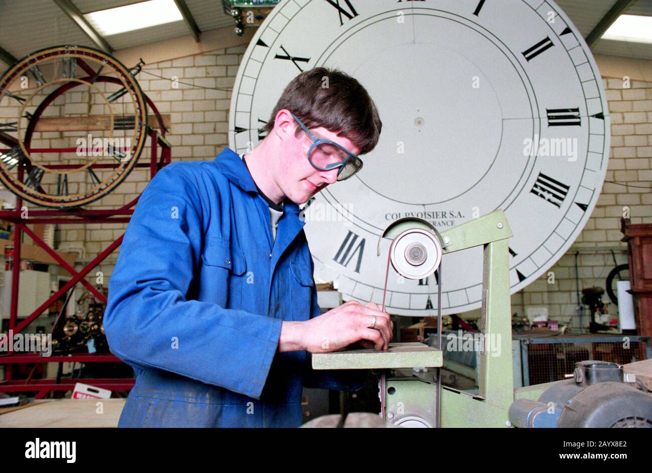 modern apprentice clock maker Stock Photo Alamy