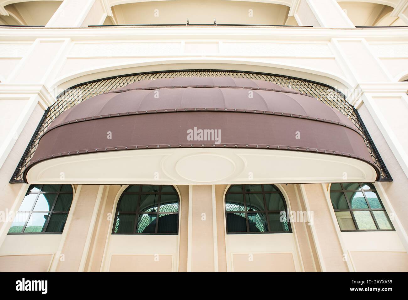 Brown awning Over Cafe Window. Cafe Tent. Canopy Sunshade for Store Window, Outdoor Market Awnings. Stock Photo