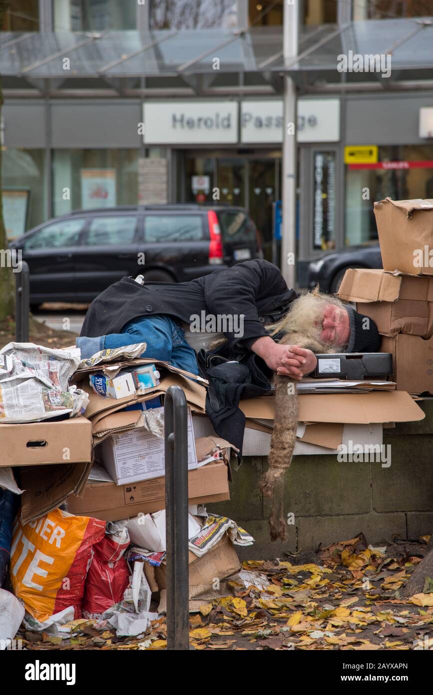 Homeless person sleeping on cardboard rubbish, Bremen, Germany Stock Photo