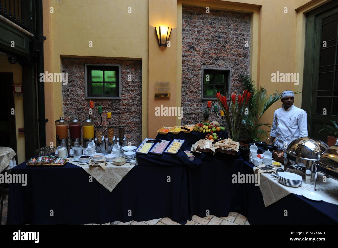 Inner courtyard with breakfast buffet at Hotel de la Opera in La Candelaria, the old town of Bogota, Colombia. Stock Photo