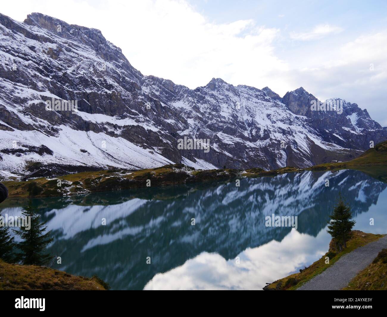 Engelberg, Switzerland: The Trübsee (lake) reflects the surrounding Alps Stock Photo