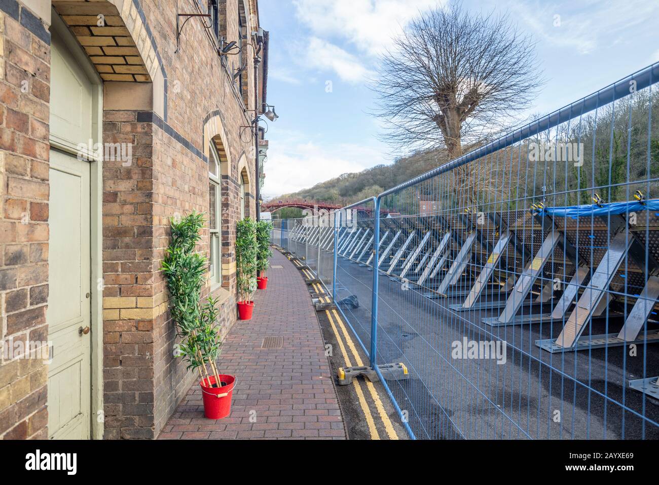 IRONBRIDGE, SHROPSHIRE, UNITED KINGDOM - FEBRUARY, 2020: Main street reinforcement by environmental agency preventing River Severn flooding after Stor Stock Photo