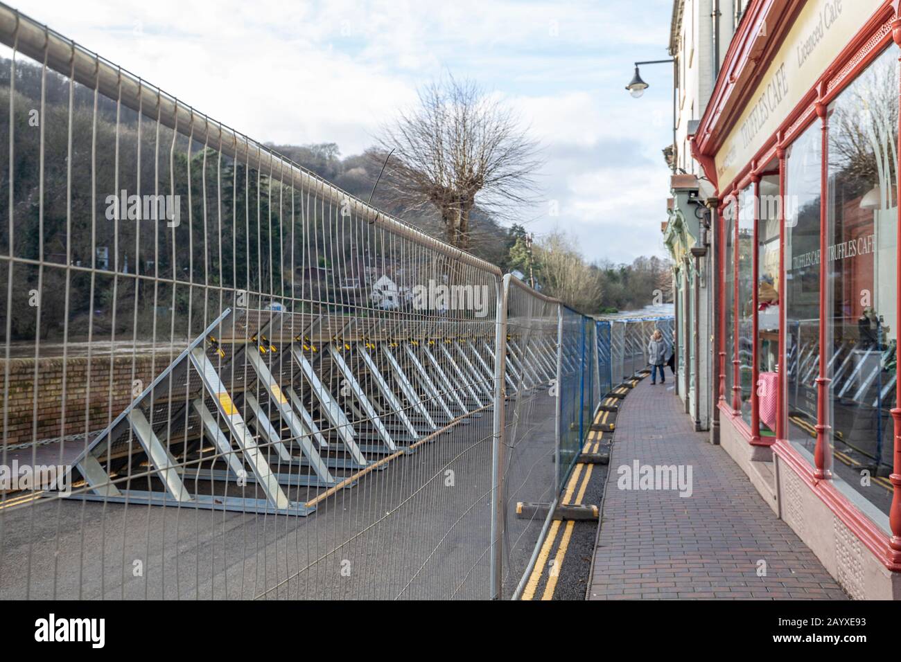 IRONBRIDGE, SHROPSHIRE, UNITED KINGDOM - FEBRUARY, 2020: Main street reinforcement by environmental agency preventing River Severn flooding after Stor Stock Photo