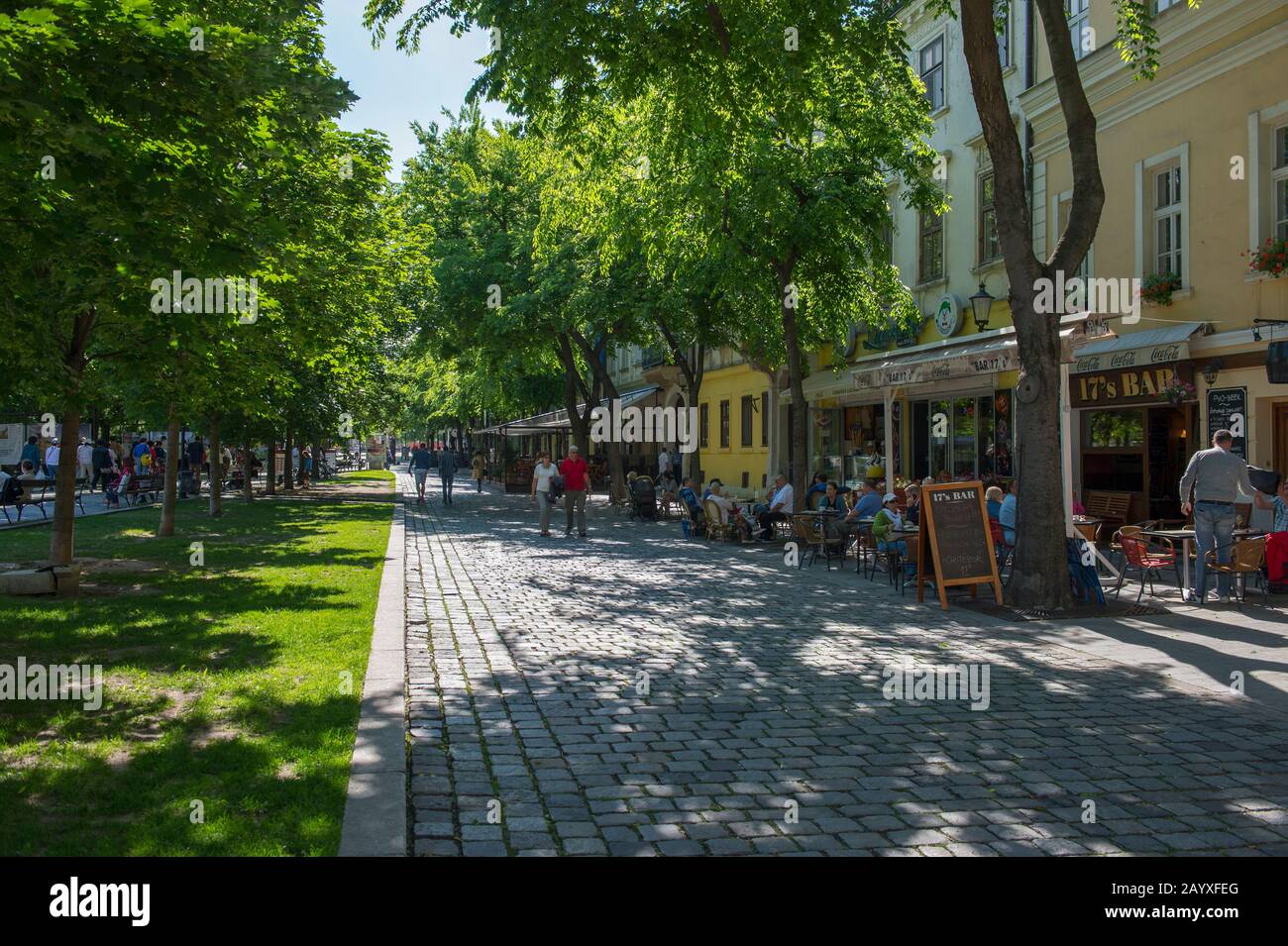 Street scene with people in sidewalk restaurants in Bratislava, the capital of Slovakia. Stock Photo