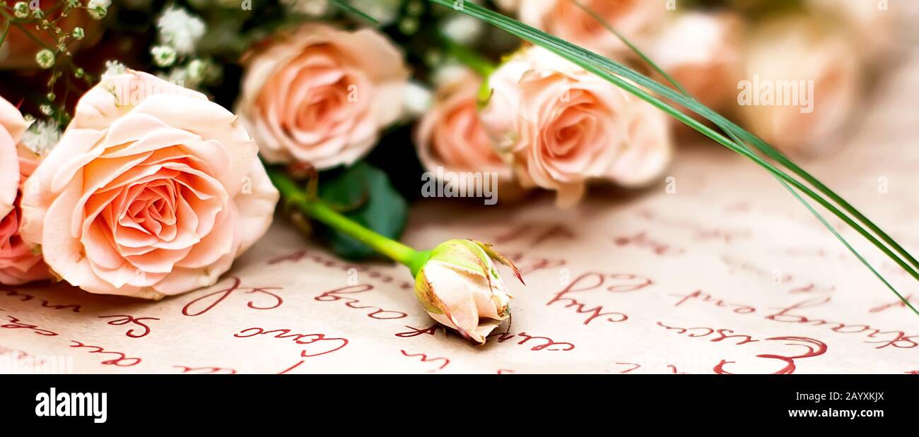 Small bouquet of beautiful peach roses in the paper, holiday concept, March 8, IMom's Day, birthday. Copy space, flat lay, Banner, Template mockup gre Stock Photo