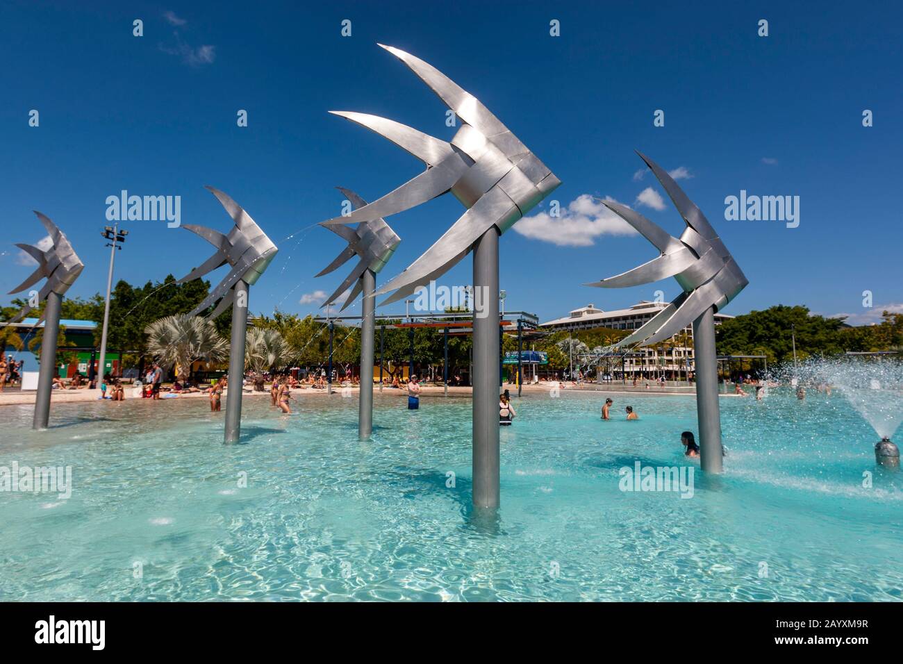 The Woven Fish sculptures by Artist Brian Robinson and people bathing