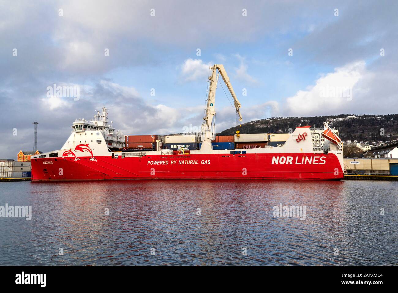 Ro-ro, general cargo and container vessel Kvitnos at work at Frieleneskaien quay in the port of Bergen, Norway.  The vessel is powered by natural gas. Stock Photo
