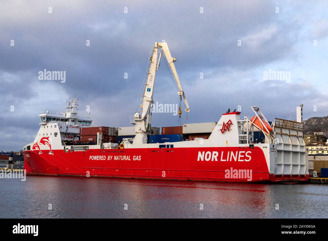 Ro-ro, general cargo and container vessel Kvitnos at work at Frieleneskaien quay in the port of Bergen, Norway.  The vessel is powered by natural gas. Stock Photo