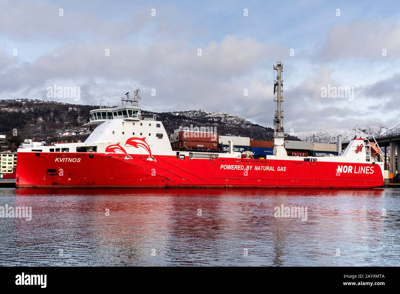 Ro-ro, general cargo and container vessel Kvitnos at work at Frieleneskaien quay in the port of Bergen, Norway.  The vessel is powered by natural gas. Stock Photo