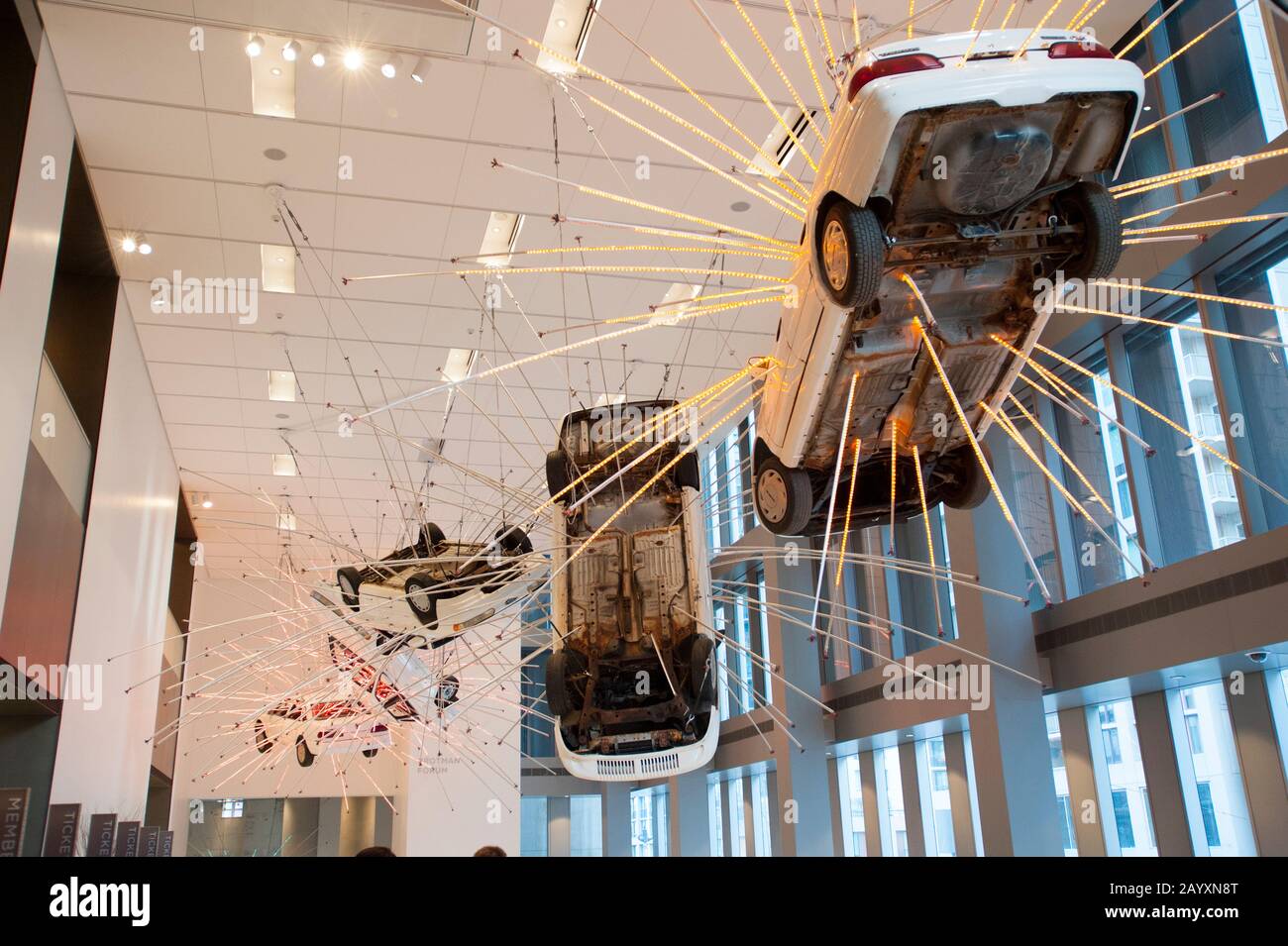 Inopportune: Stage One, from 2004, is a large-scale installation work consisting of a meticulous arrangement of life-size cars and multichannel tubes Stock Photo