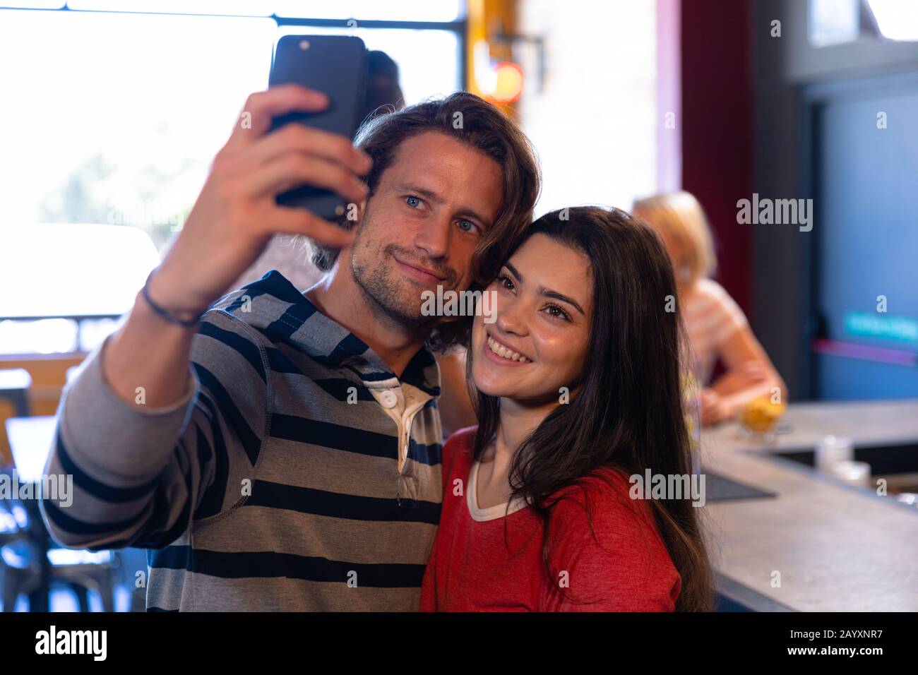 Friends taking selfies together Stock Photo