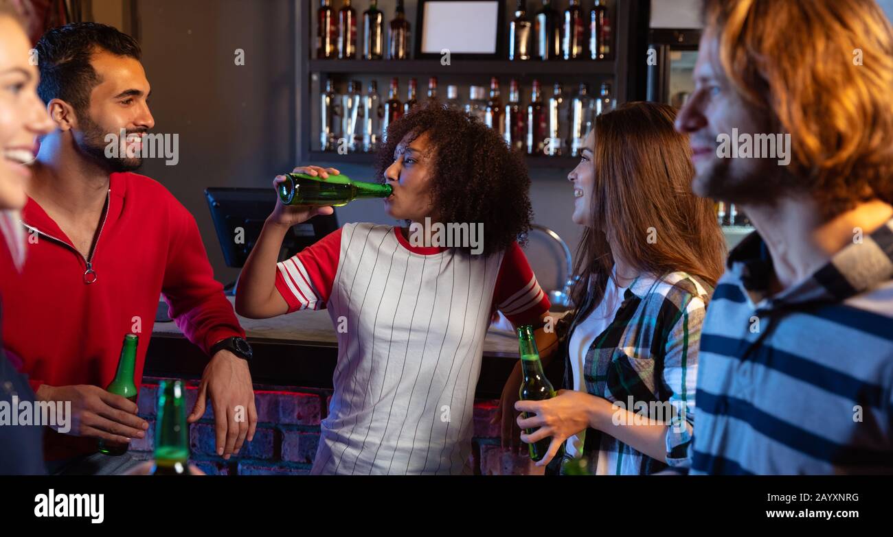 Friends having fun together while drinking Stock Photo