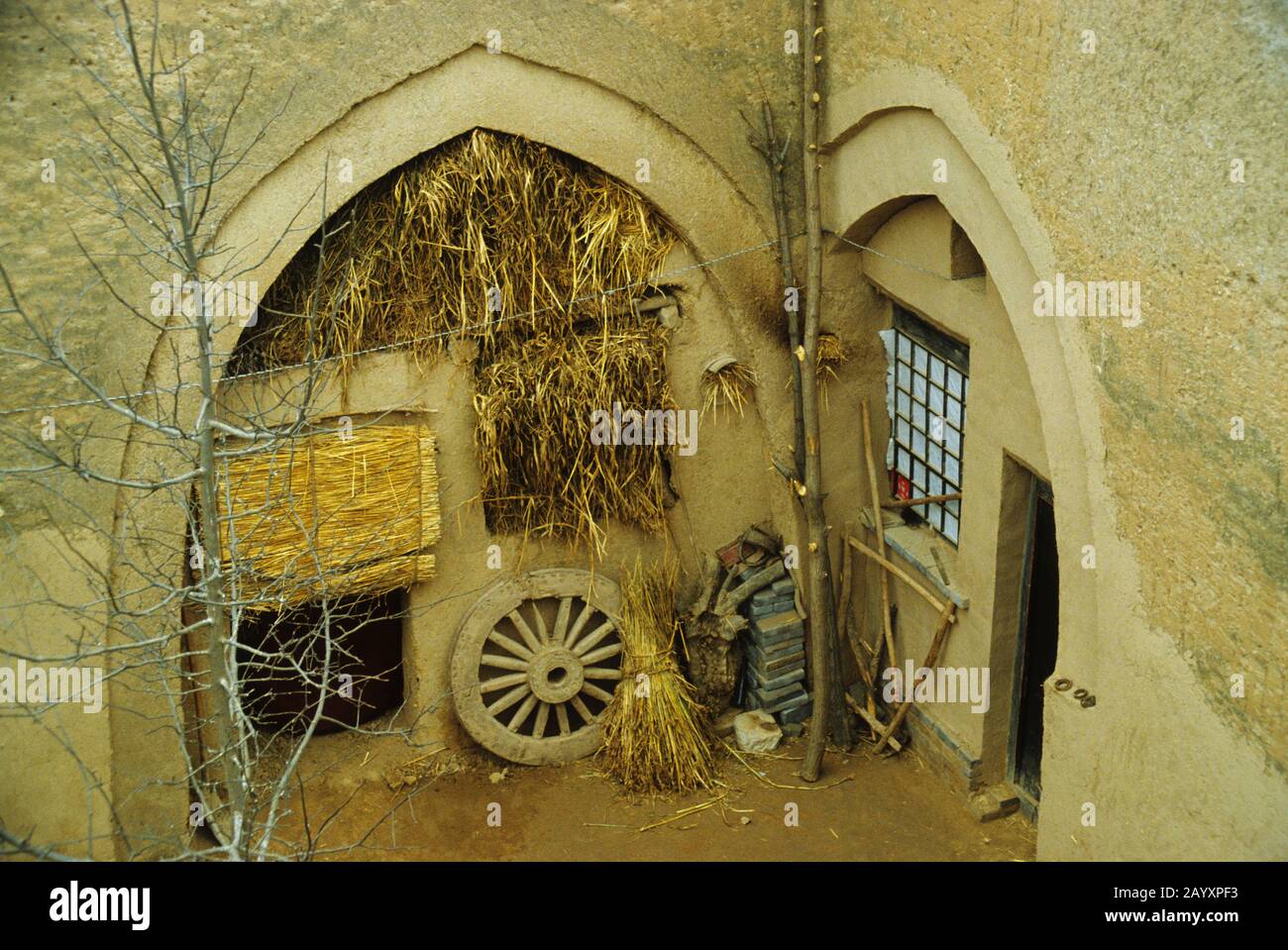 View of underground dwellings dug into Loess serving as interior courtyard, called yaodong-well or sunken courtyard near the city of Xian, China. Stock Photo