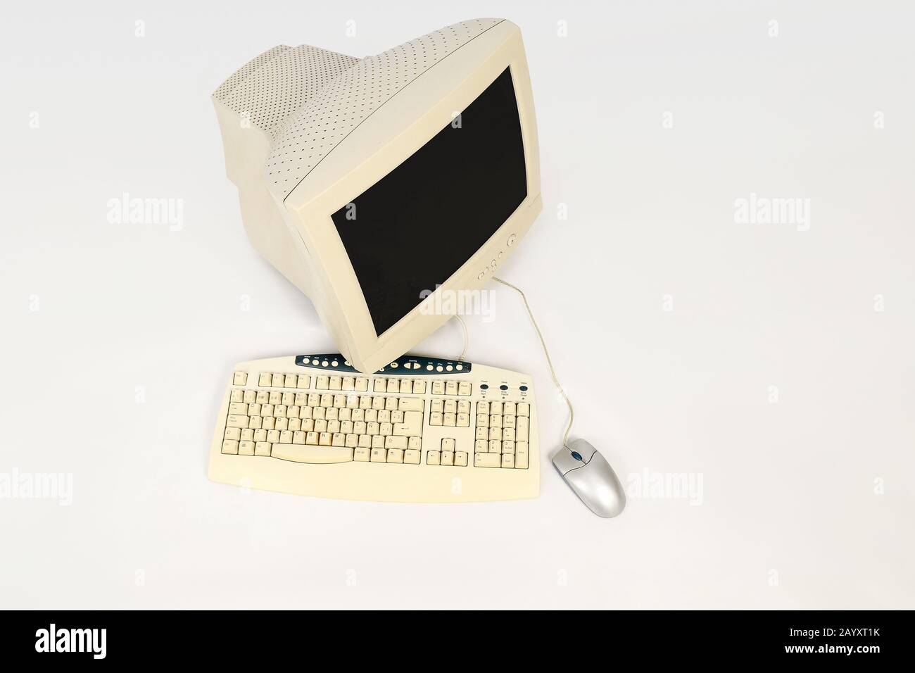 Old computer with keyboard and mouse on white background, seen from ...