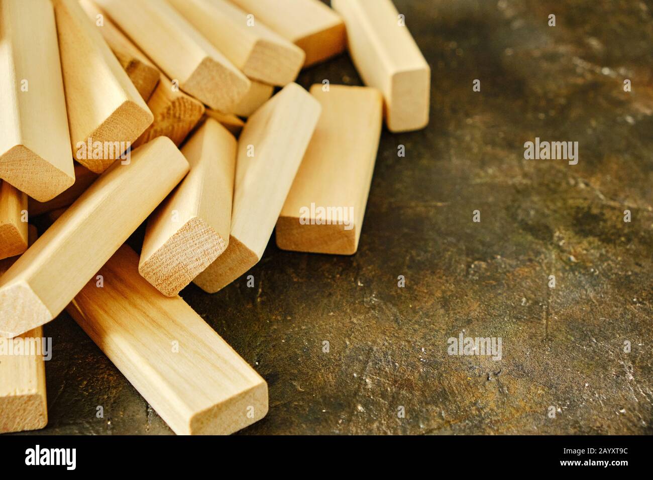Scattering of wooden bricks on the old concrete floor Stock Photo