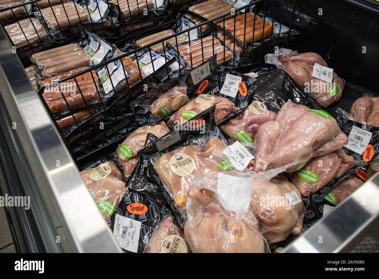 The meat counter of a supermarket with natural and organic products. Stock Photo