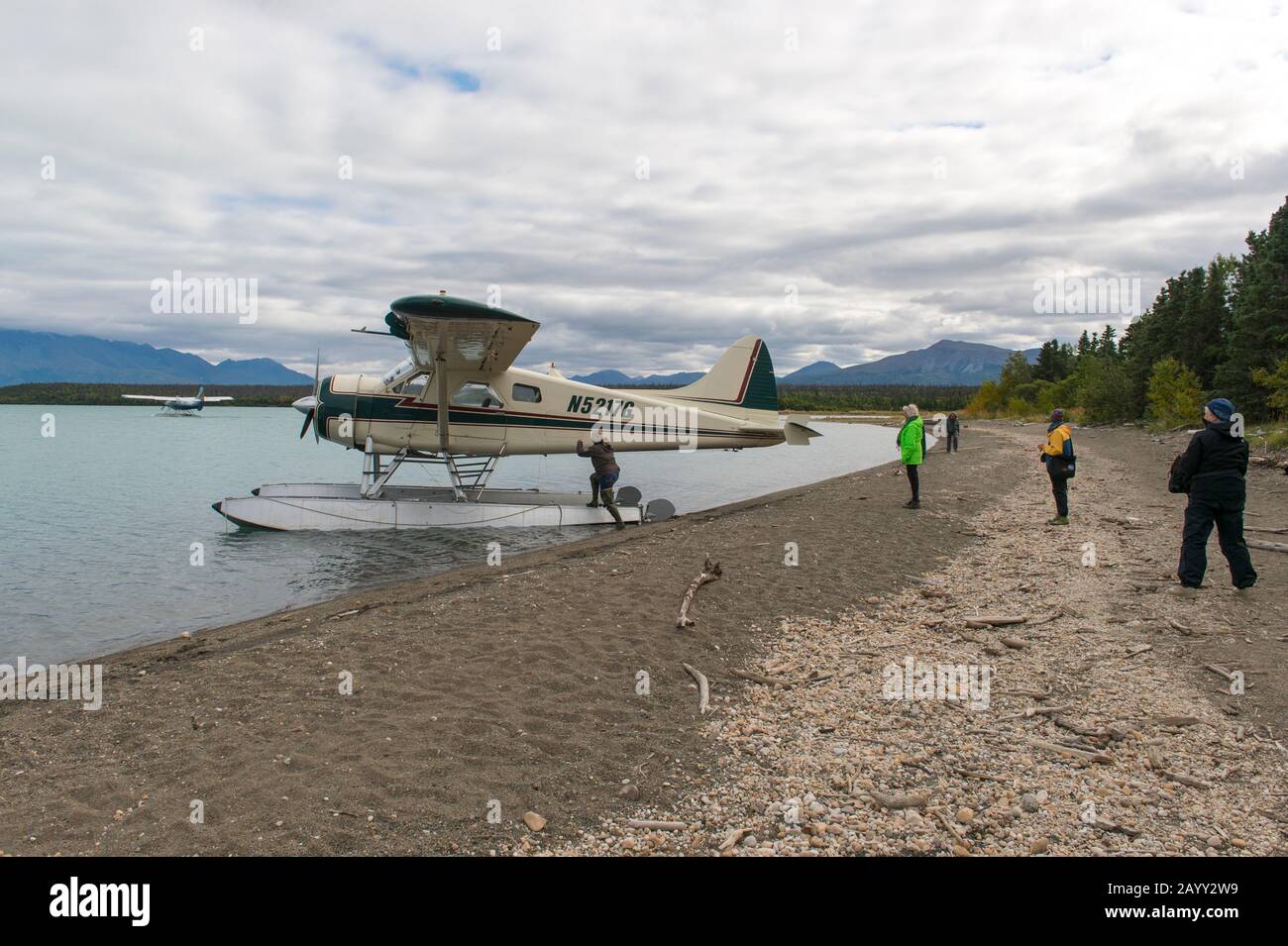 People boarding a floatplane at the beach of Naknek Lake near the