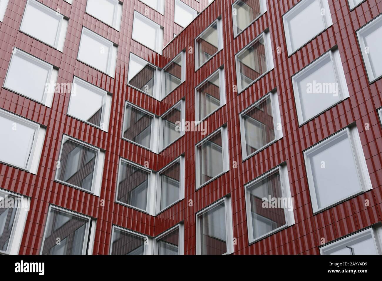Front of the red tower of the Löwenbräu building in Zurich Stock Photo