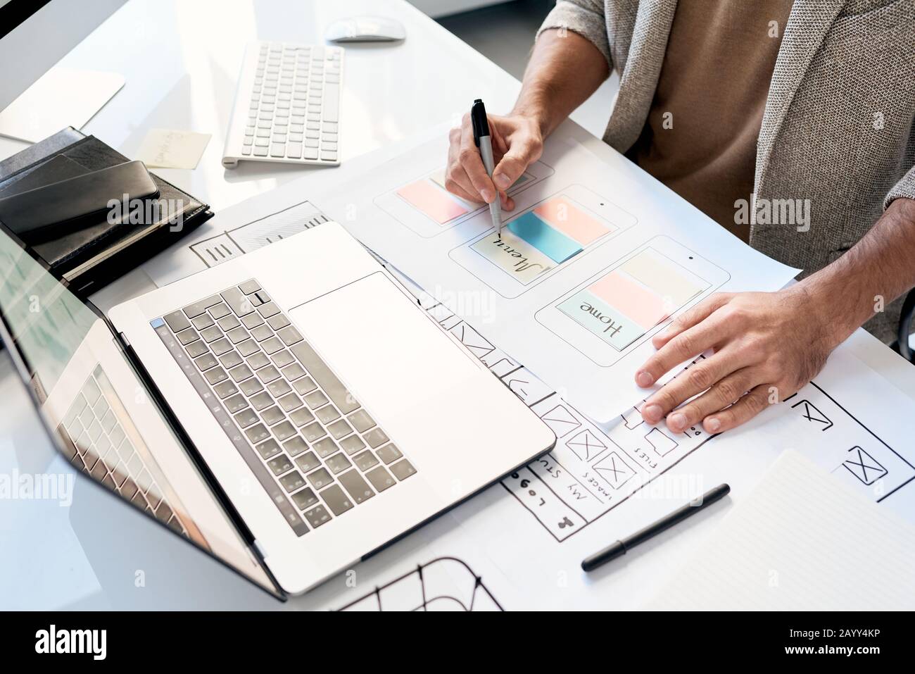Unrecognizable professional software designer working on new application sketch, horizontal high angle shot Stock Photo