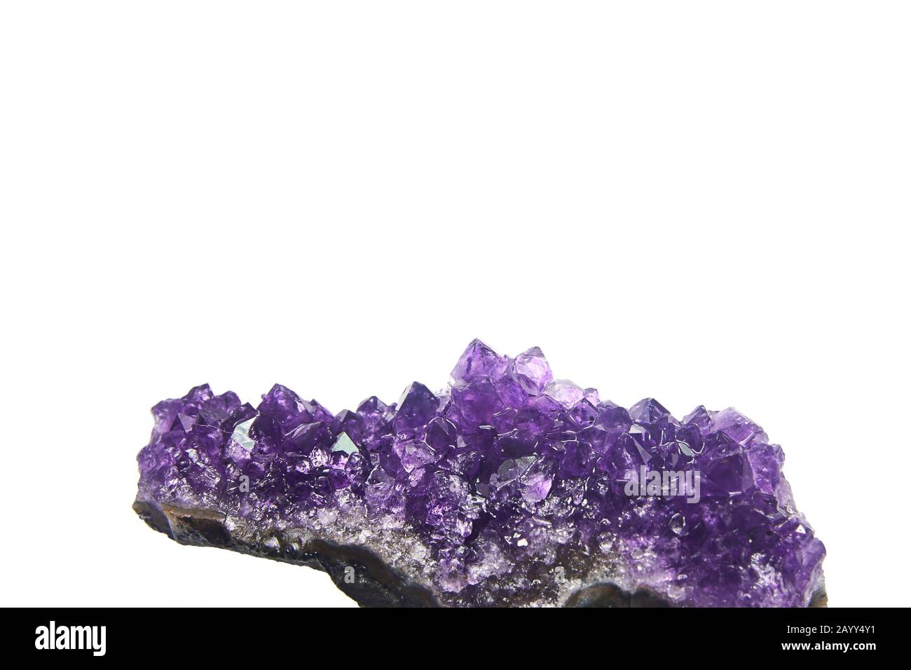 Amethyst crystals geode isolated on white background. Stock photo Stock