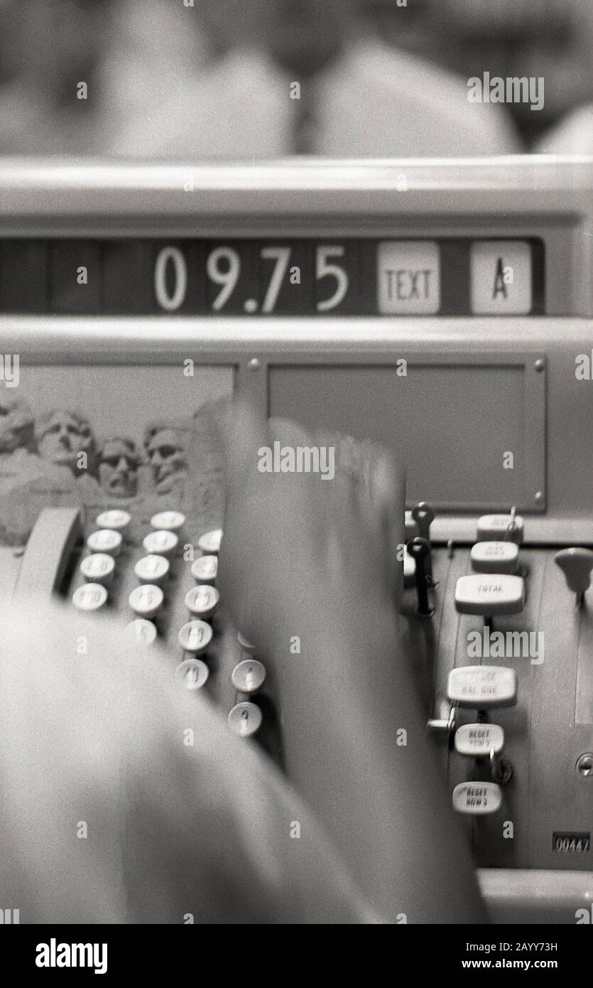 1964, historical, closeup, a female hand at the keys of a mechanical