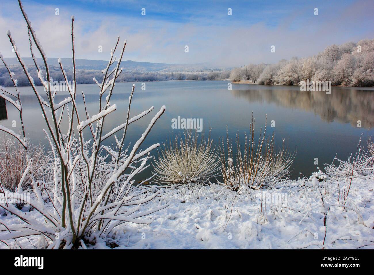 the first snow on a mountain lake Stock Photo - Alamy