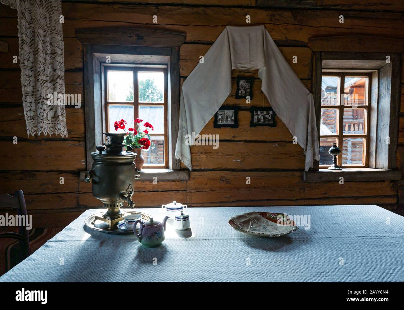 House log cabin interior with Samovar, depicting traditional way of life, Taltsy Museum of Wooden Architecture, Irkutsk Region, Siberia, Russia Stock Photo