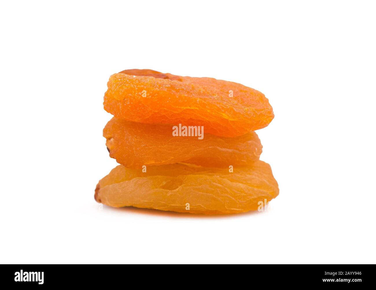 Candied fruit, three apricots isolated on white Stock Photo Alamy
