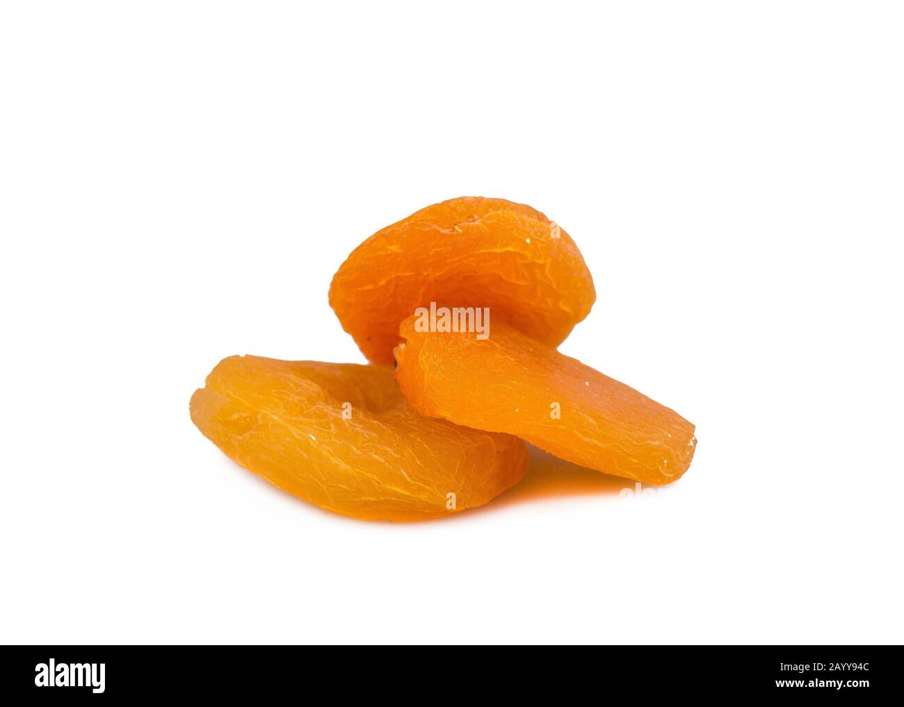 Candied fruit, three apricots isolated on white Stock Photo Alamy