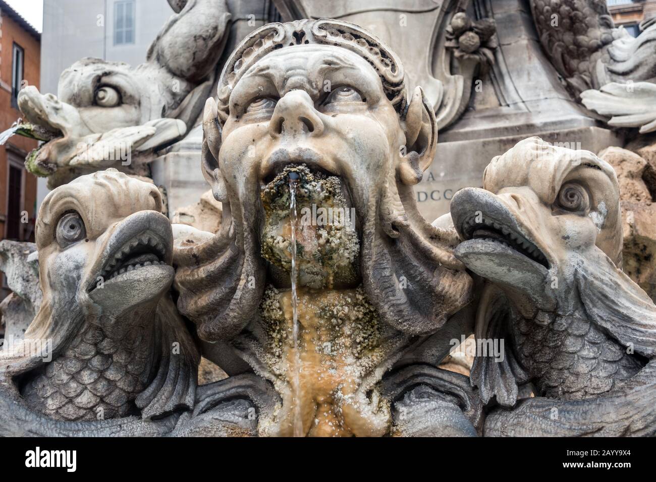 Face and waterspout at Fontana del Pantheon  a fountain which stands near the Pantheon in the Piazza della Rotonda Rome Italy. Stock Photo