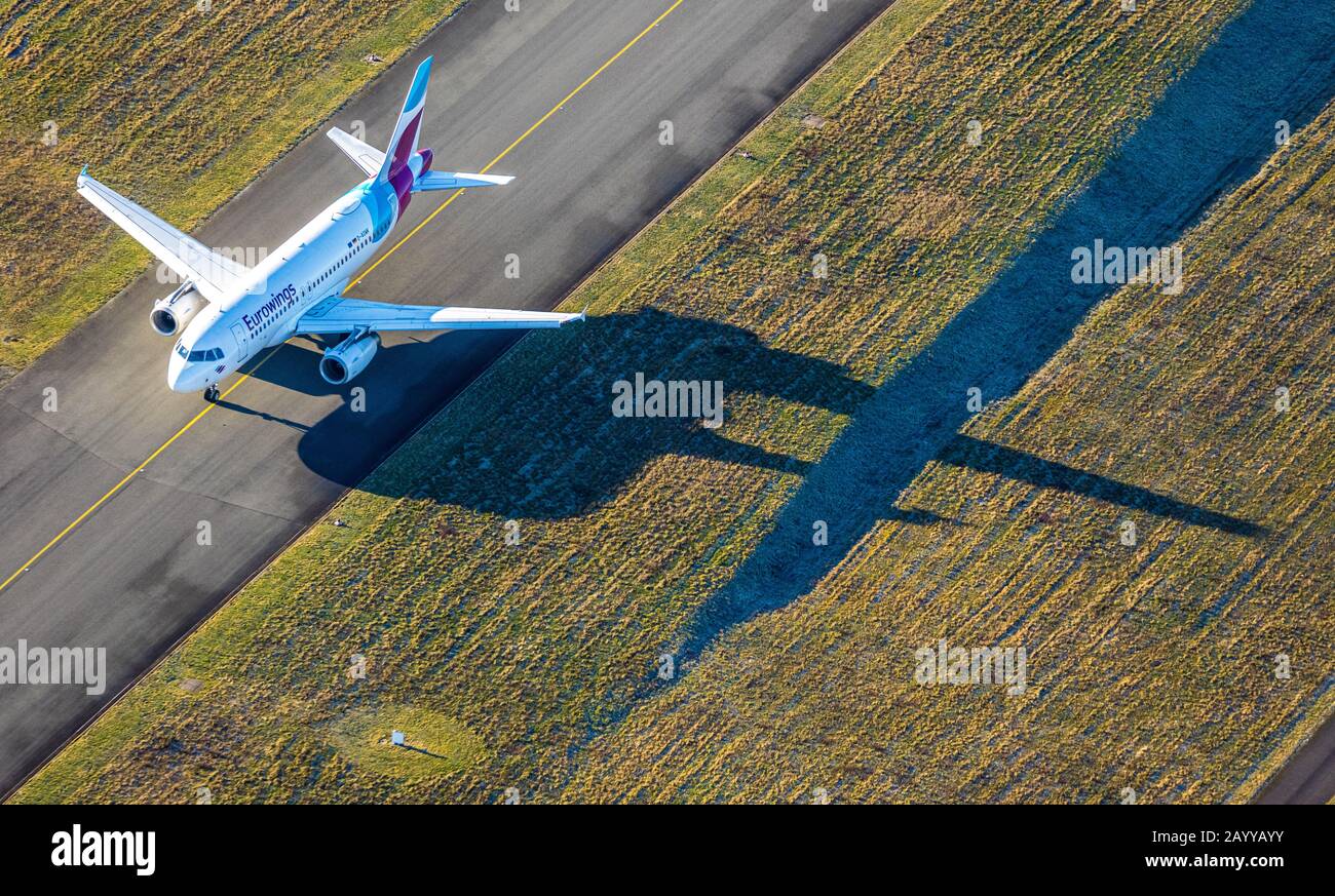 Aerial photo, runway Dortmund airport on which a Eurowings aircraft is taxiing, Dortmund, Ruhr area, North Rhine-Westphalia, Germany, DE, Europe, bird Stock Photo