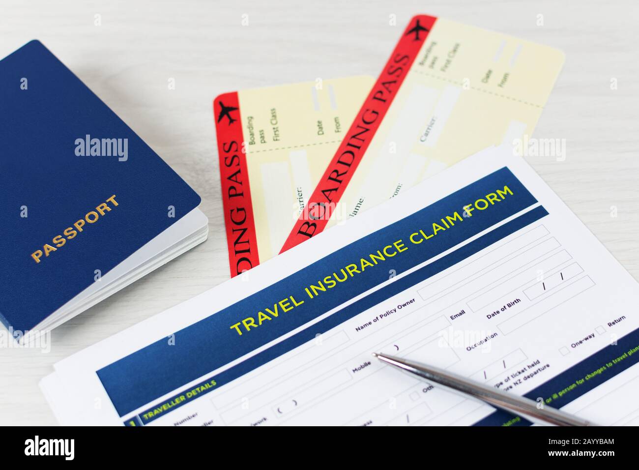 Travel Insurance Claim Form With A Boarding Pass And Passport On White Wooden Table Travel Policy Concept Stock Photo Alamy