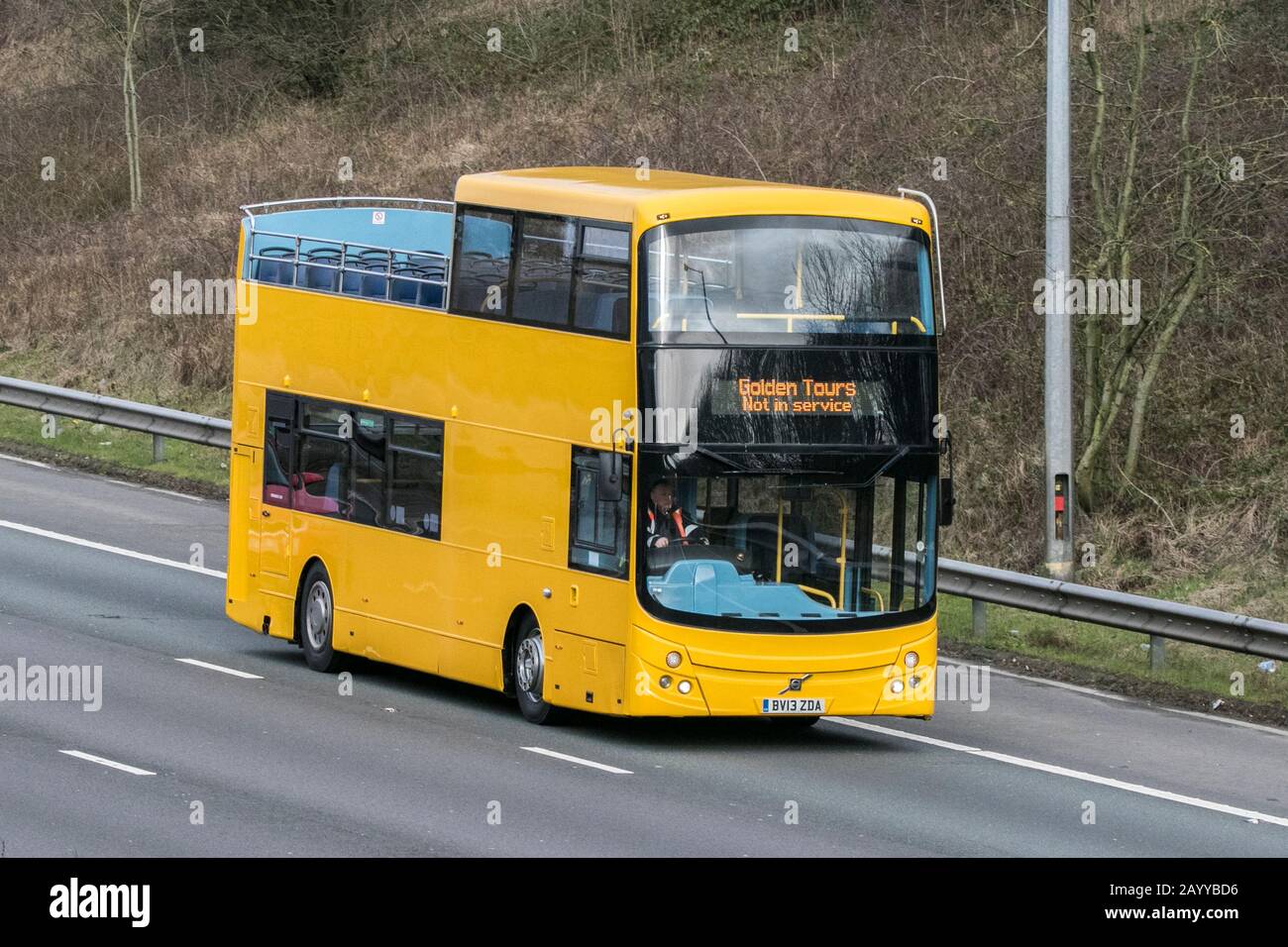 Volvo B9TL open top, low-floor double-decker bus built by Volvo from 2002 until 2018; double decker vehicle movement driving on the M6 motorway nea Stock Photo