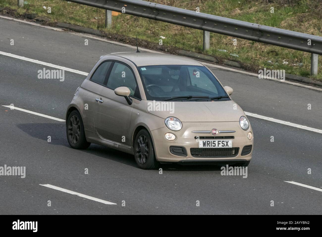 2015 Fiat 500 S Beige Car Petrol vehicle movement driving on the M6 motorway near Preston in Lancashire Stock Photo