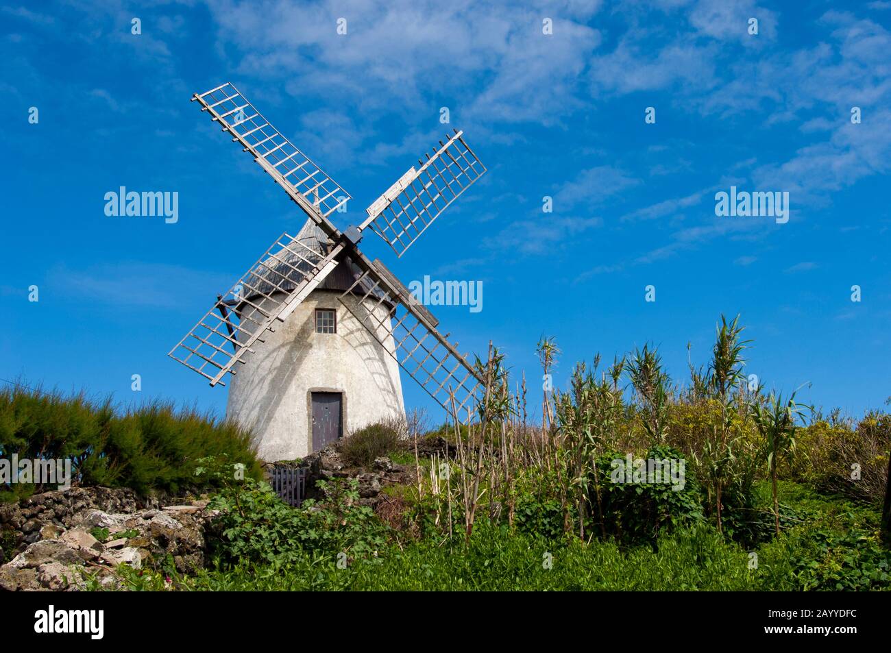 An old windmill on a hill near Santa Cruz on Graciosa Island in the Azores, Portugal. Stock Photo