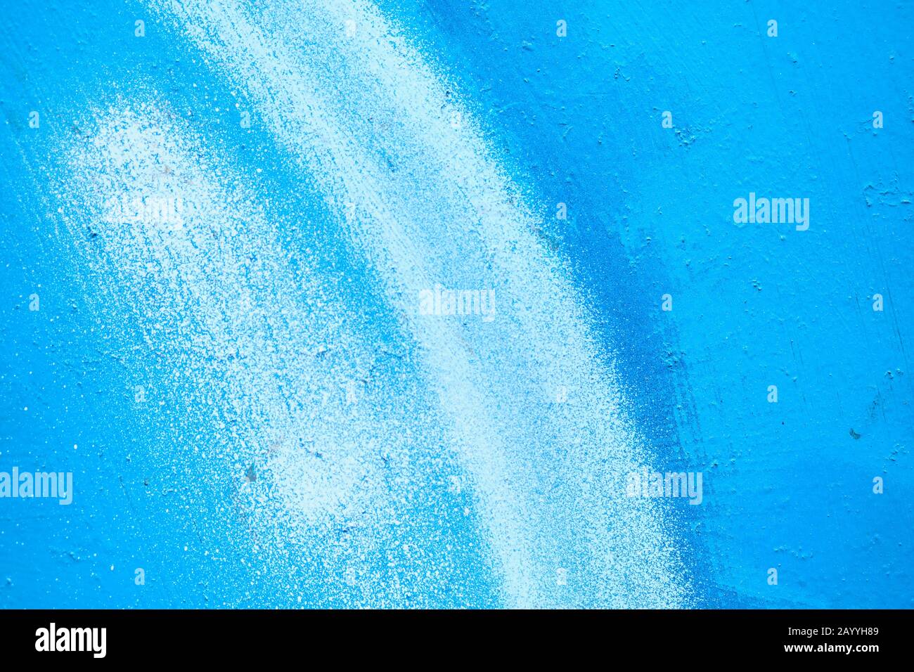 Abstract metal texture painted with a brush of blue and white. Close up. Stock Photo