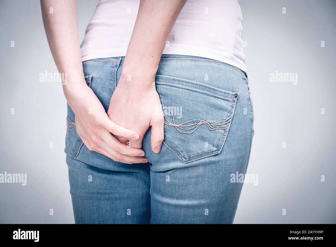 The girl massages her foot due to severe bruising and pain. Close up