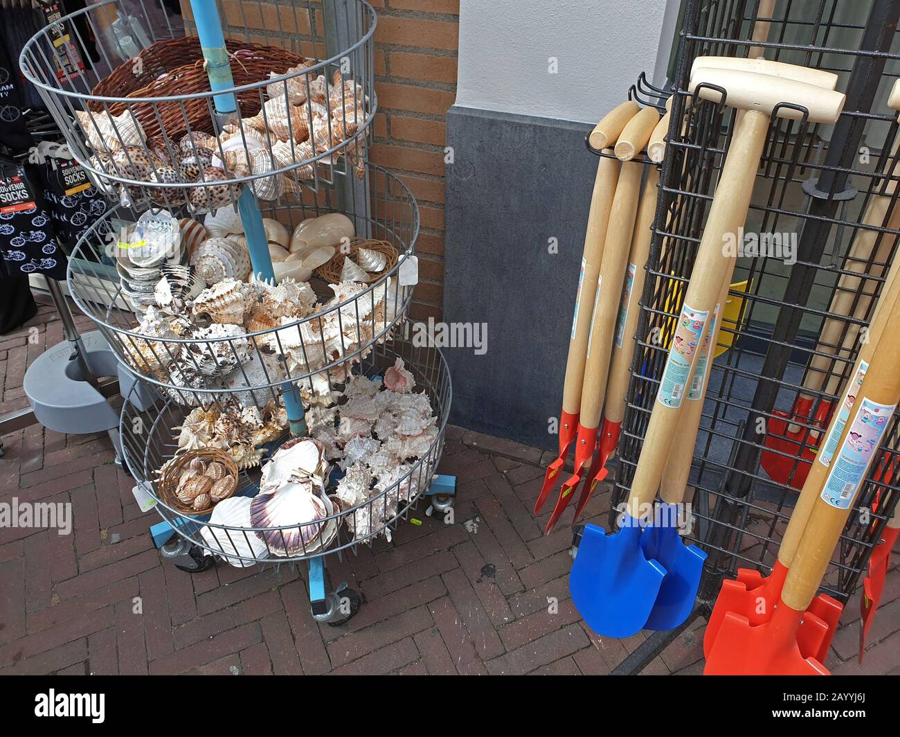sale of chovels, tropical shells and snail shells at a souvenir shop at the North Sea, Netherlands, Noordwijk aan Zee Stock Photo
